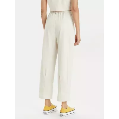 Pantalon femme Champion Wide Leg 117110-YS137 beige avec coupe large, taille haute élastique et logo Champion