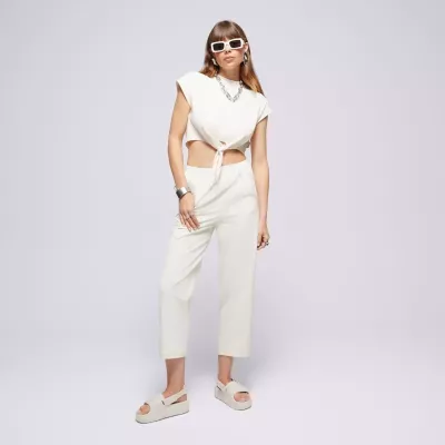 Pantalon femme Champion Wide Leg 117110-YS137 beige avec coupe large, taille haute élastique et logo Champion