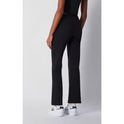 Pantalon femme Champion Wide Leg 117129-KK001 noir avec coupe ample fluide, taille élastique et tissu coton extensible