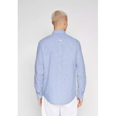 Chemise Tommy Jeans SLIM STRETCH OXFORD DM0DM09594-C8T bleu ciel en coton Oxford bio extensible coupe ajustée