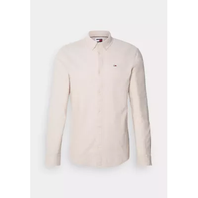 Chemise Tommy Jeans SLIM STRETCH OXFORD DM0DM09594-AB9 beige en coton Oxford bio extensible coupe ajustée