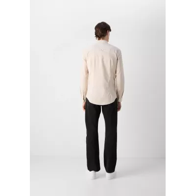 Chemise Tommy Jeans SLIM STRETCH OXFORD DM0DM09594-AB9 beige en coton Oxford bio extensible coupe ajustée