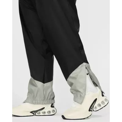 Pantalon Nike Windrunner Woven Lined homme noir et gris DX0653-015