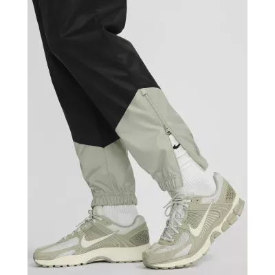 Pantalon Nike Windrunner Woven Lined homme noir et gris DX0653-015