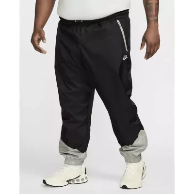 Pantalon Nike Windrunner Woven Lined homme noir et gris DX0653-015