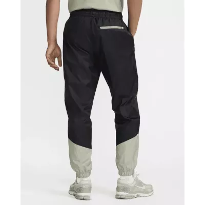 Pantalon Nike Windrunner Woven Lined homme noir et gris DX0653-015