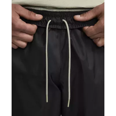 Pantalon Nike Windrunner Woven Lined homme noir et gris DX0653-015