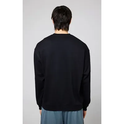 Sweatshirt Champion Modern Basket Crewneck noir homme référence 219799-KK001 style basket et streetwear moderne