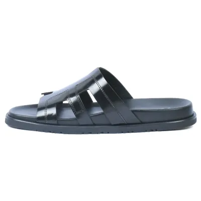 Mules homme ELITO EL-26103-N en cuir véritable noir avec bride large ajourée et semelle EVA confortable.