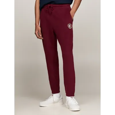 Pantalon de survêtement Tommy Jeans homme bordeaux DM0DM19805-VLP, 100 % coton, Regular Fit avec crest brodé et taille à cordon.