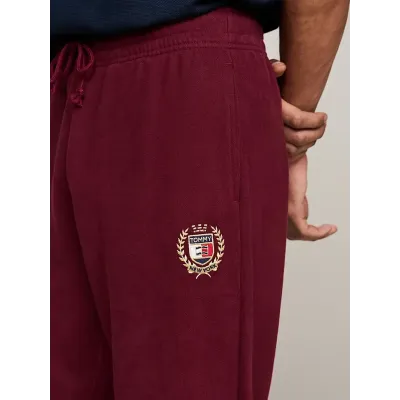 Pantalon de survêtement Tommy Jeans homme bordeaux DM0DM19805-VLP, 100 % coton, Regular Fit avec crest brodé et taille à cordon.
