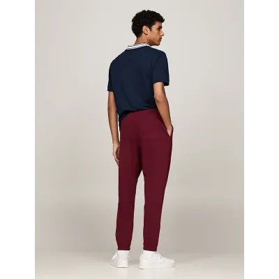 Pantalon de survêtement Tommy Jeans homme bordeaux DM0DM19805-VLP, 100 % coton, Regular Fit avec crest brodé et taille à cordon.