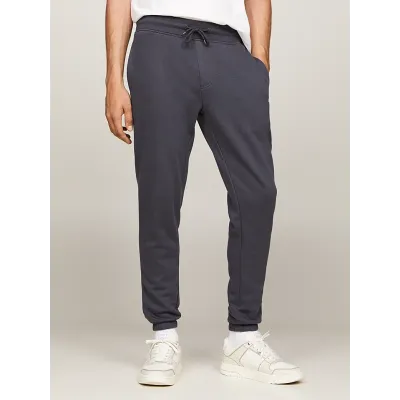 Jogging Tommy Jeans homme gris DM0DM20473-PUB, coupe Slim avec molleton coton mélangé, poignets resserrés.