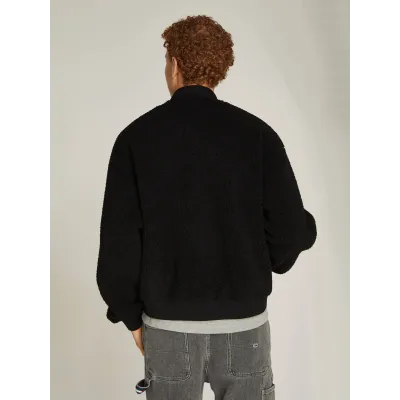 Bomber teddy Tommy Jeans homme noir DM0DM20502-BDS, texture effet moutonné, coupe Relaxed Fit, col montant.