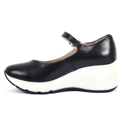 Chaussure femme en cuir noir avec bride et semelle compensée blanche