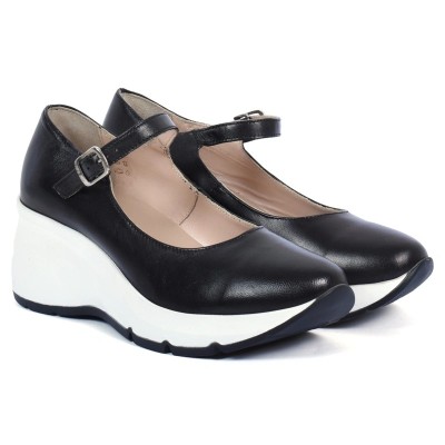 Chaussure femme en cuir noir avec bride et semelle compensée blanche